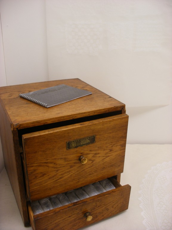 Juliet Guiness ©,Memorial, Lead covered Book and wooden chest.