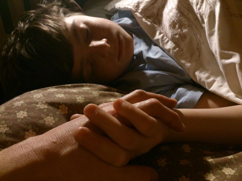 Sydney falling asleep holding my hand, October 2013, Helen Sargeant ©